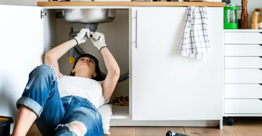 A homeowner trying DIY plumbing repair
